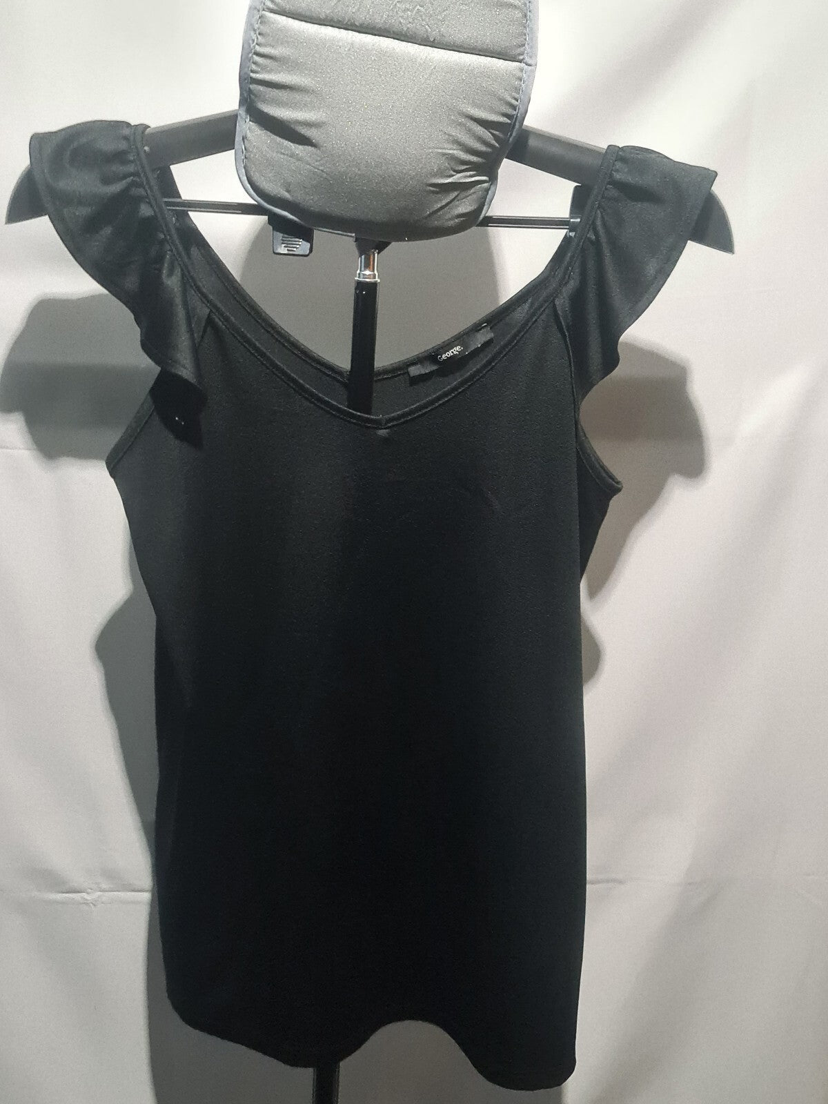 George black sleeveless top with shoulder bows