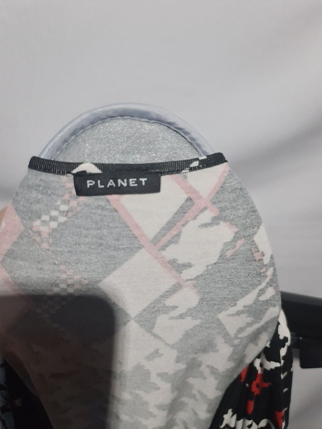 Planet red black and white patterned top