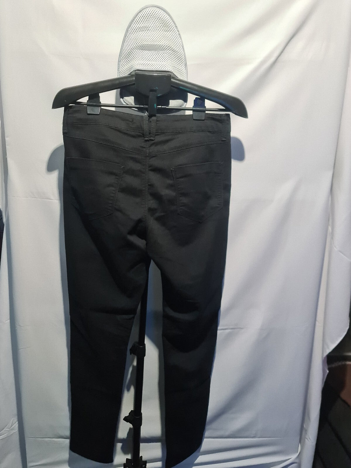Black track pants with pink side stripes