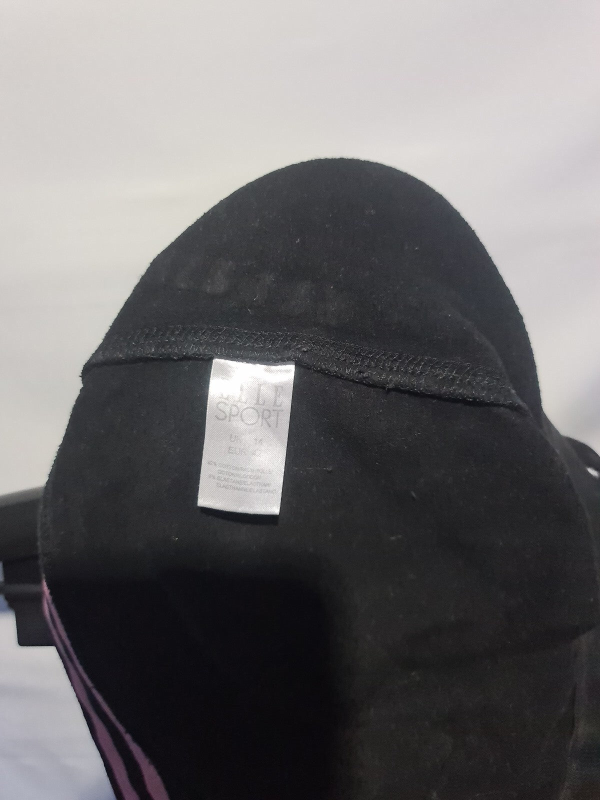 Black track pants with pink side stripes